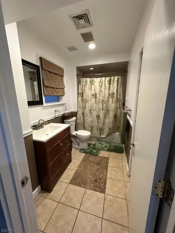 a kitchen with a stove a sink and a refrigerator