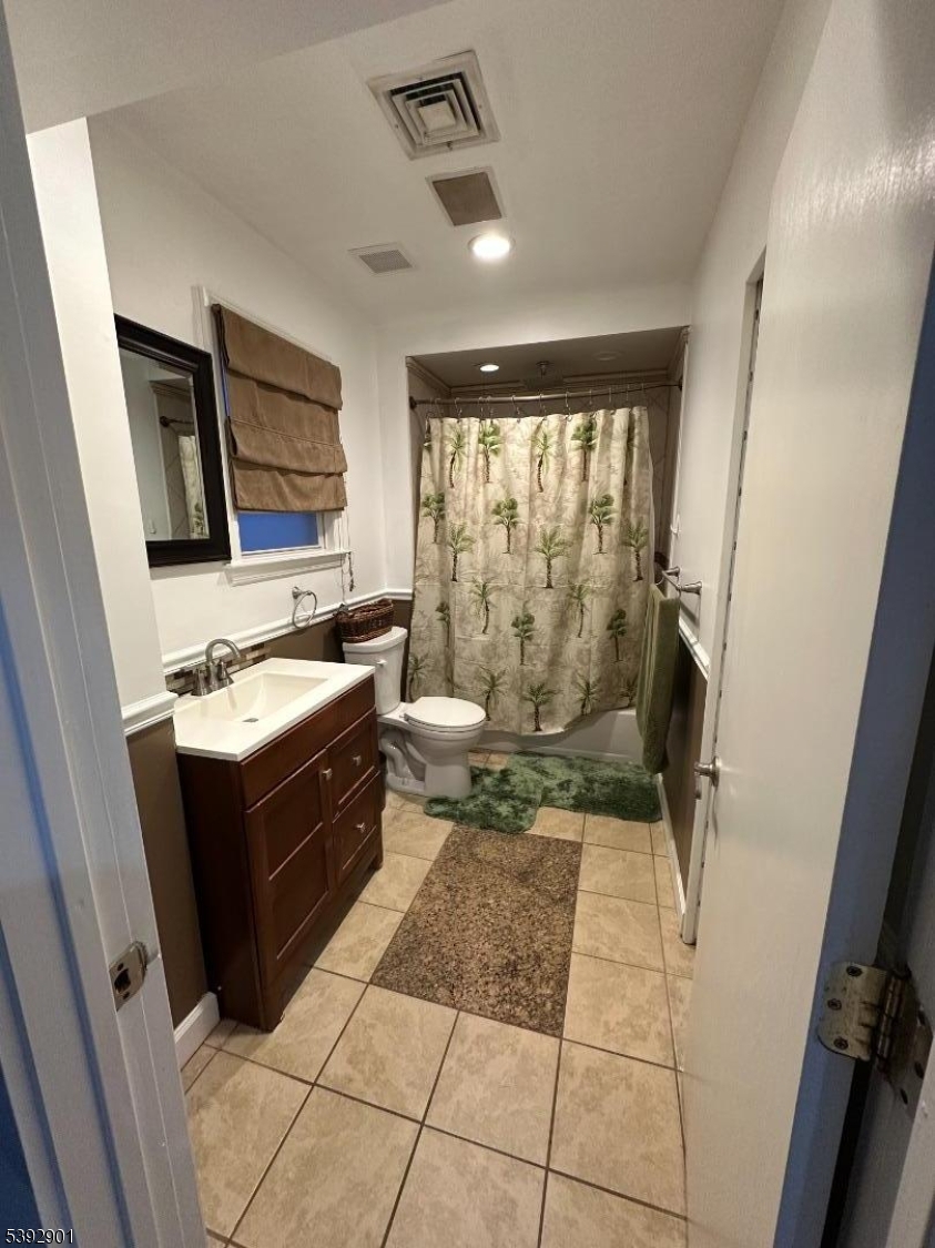 a kitchen with a stove a sink and a refrigerator