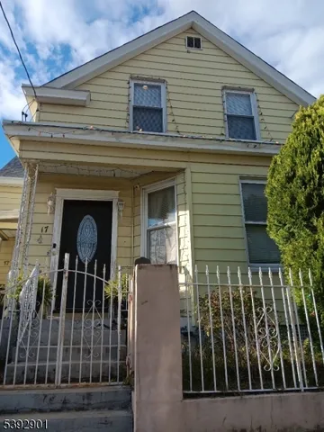 a view of a house with brick walls