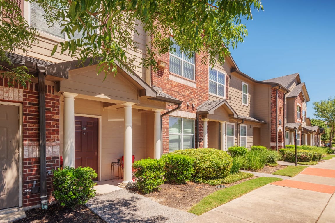 12101 Dessau Road, Unit 2404 Austin, TX 78754 - Photo 4 of 20 a front view of a house with yard and green space