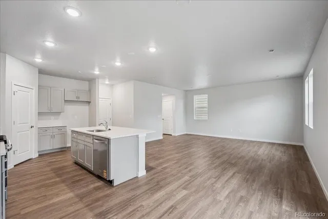 a kitchen with stainless steel appliances granite countertop a stove and a refrigerator