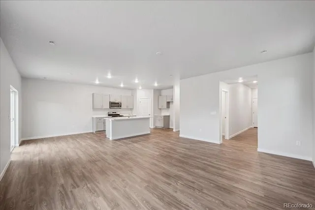 a view of kitchen with wooden floor