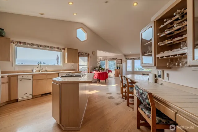 a spacious bedroom with a bed and a large window