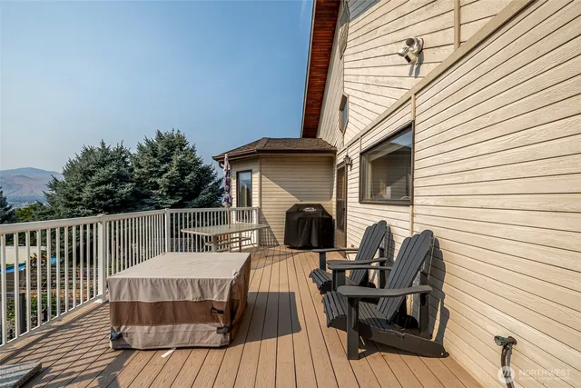 a view of a house with a backyard and a patio