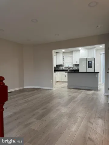 a kitchen with wooden cabinets and stainless steel appliances