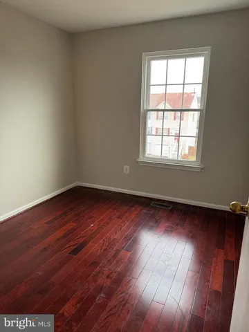 a white toilet and tub sitting next to a bathroom sink