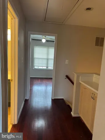 a white toilet sitting next to a bath tub and a shower