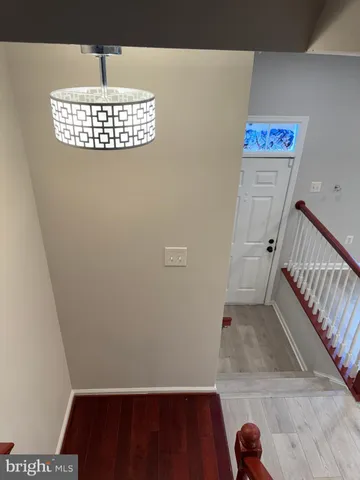 a kitchen with a refrigerator and a stove top oven