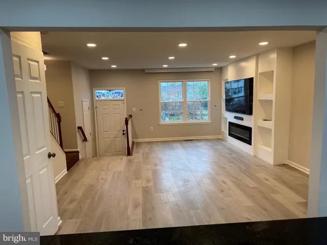 a view of a living room with a flat screen tv