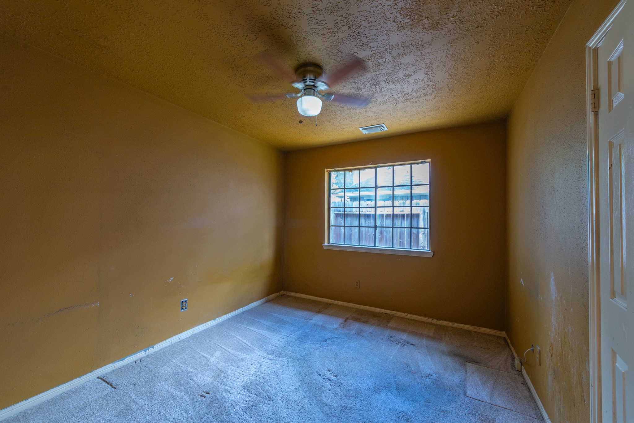 12203 Canterhurst Way Houston, TX 77065 - Photo 13 of 23 an empty room with a window