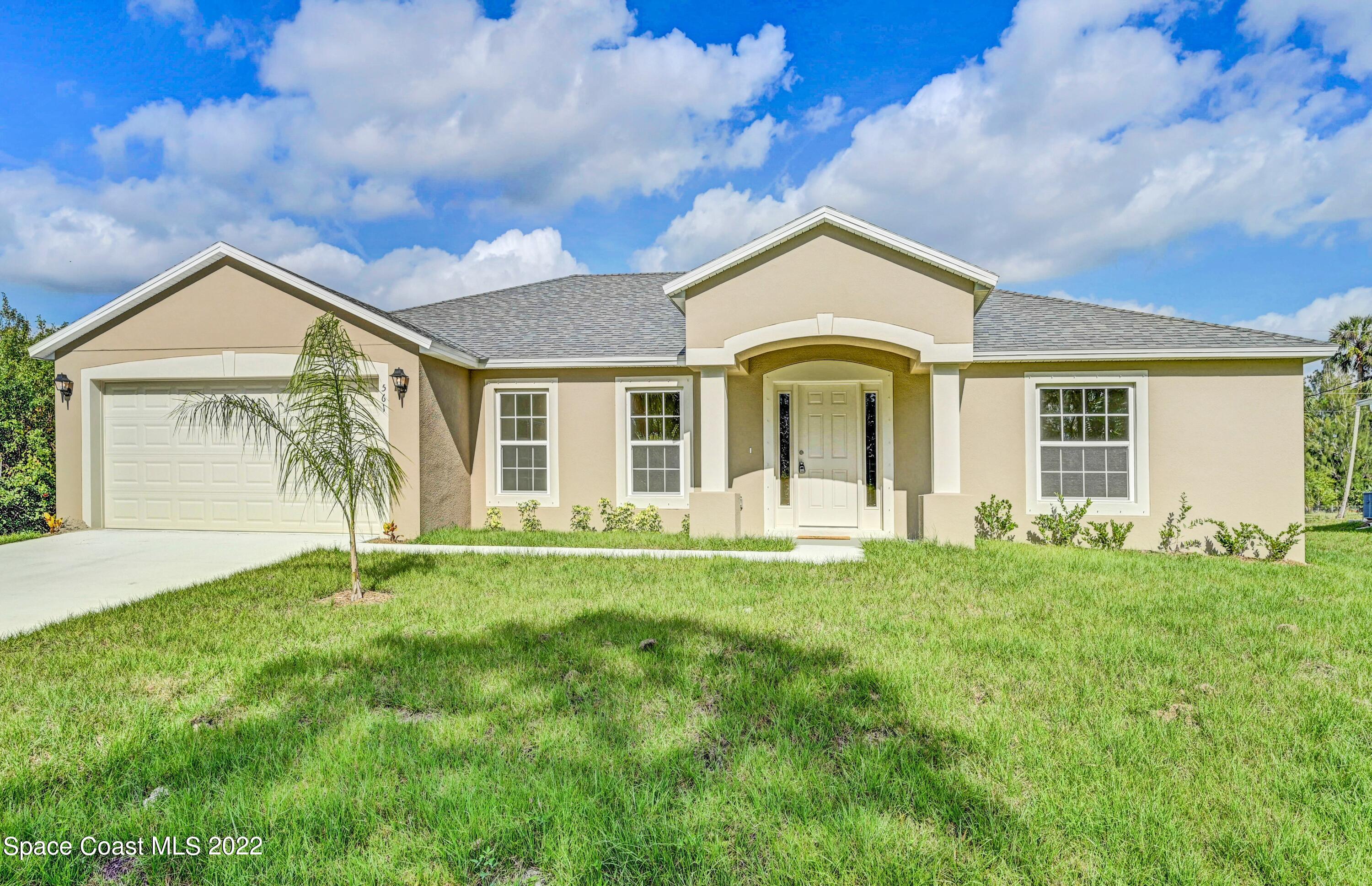 front view of a house with a yard