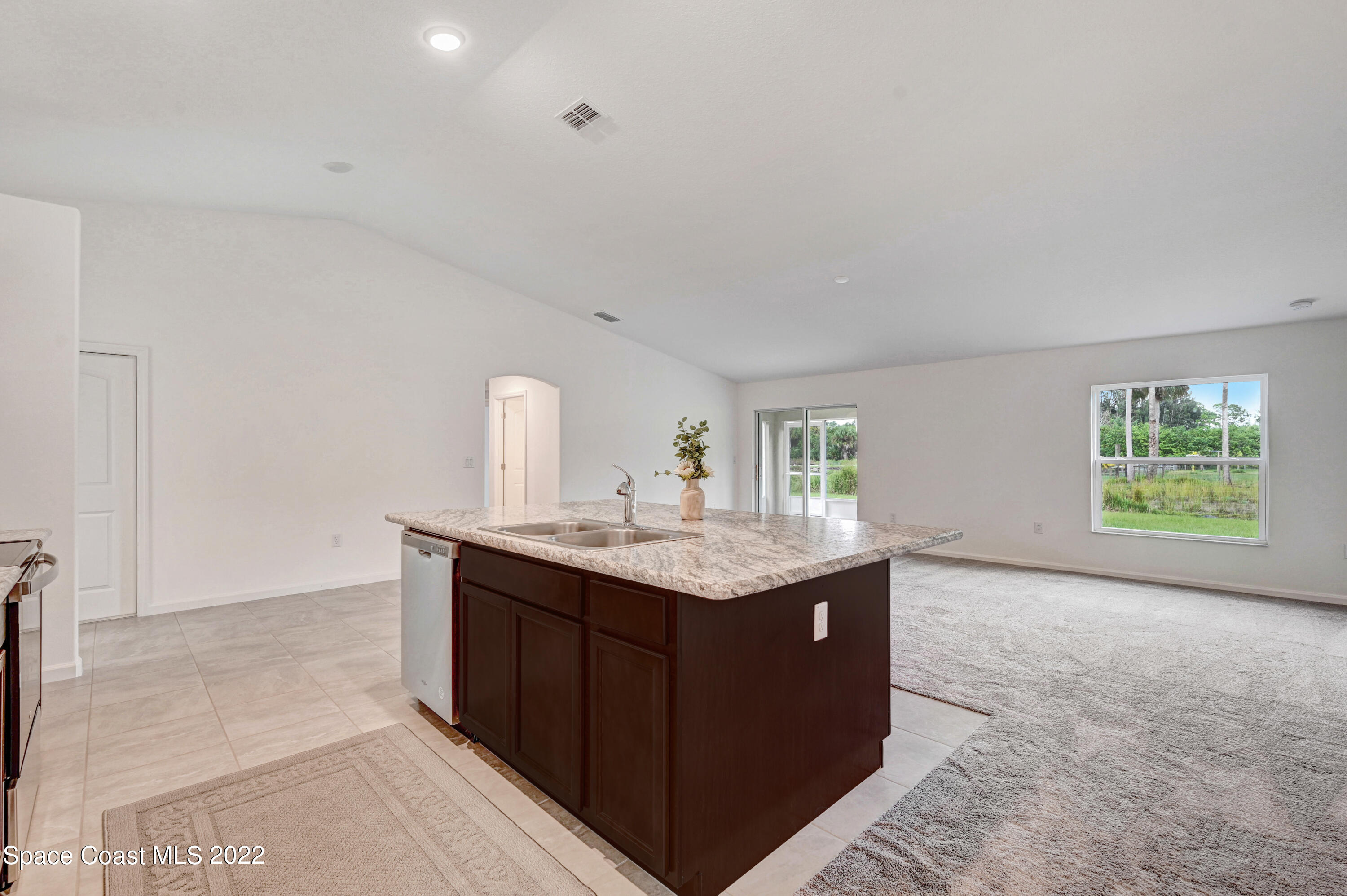 561 Scenic Road Palm Bay, FL 32908 - Photo 15 of 40 a kitchen with a sink and a window