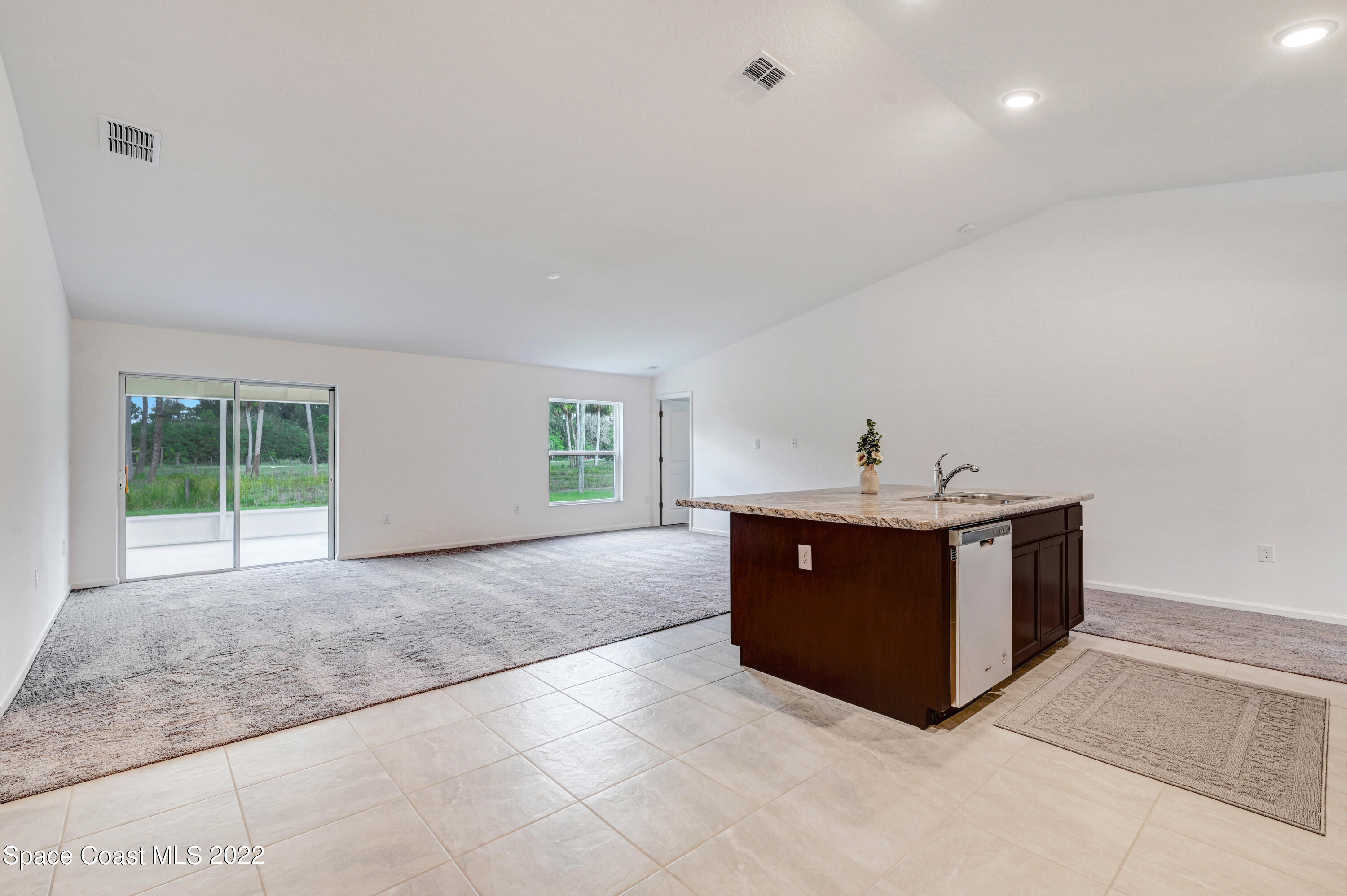 561 Scenic Road Palm Bay, FL 32908 - Photo 20 of 40 a room with a cabinets and sink