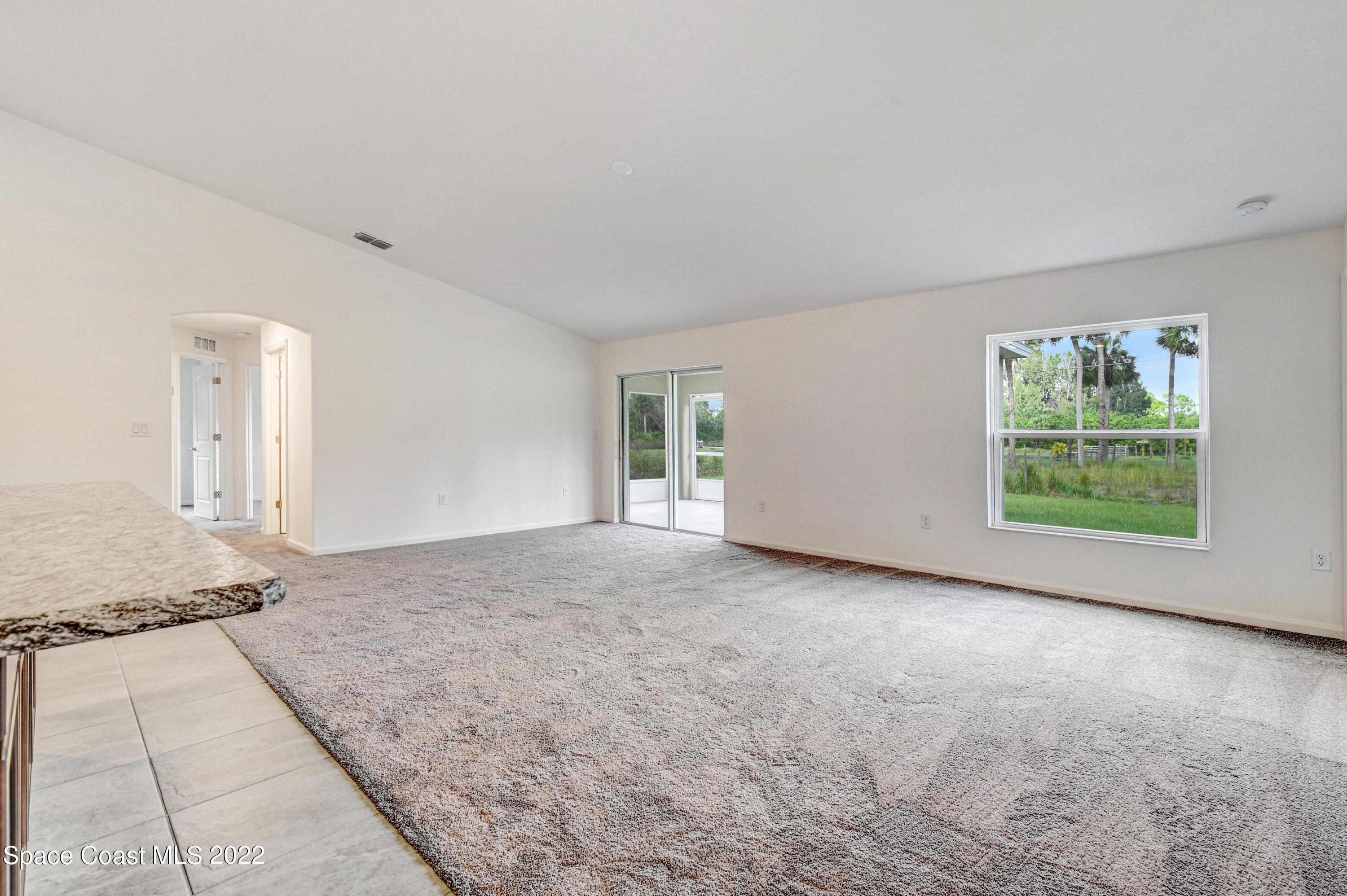 561 Scenic Road Palm Bay, FL 32908 - Photo 24 of 40 an empty room with windows