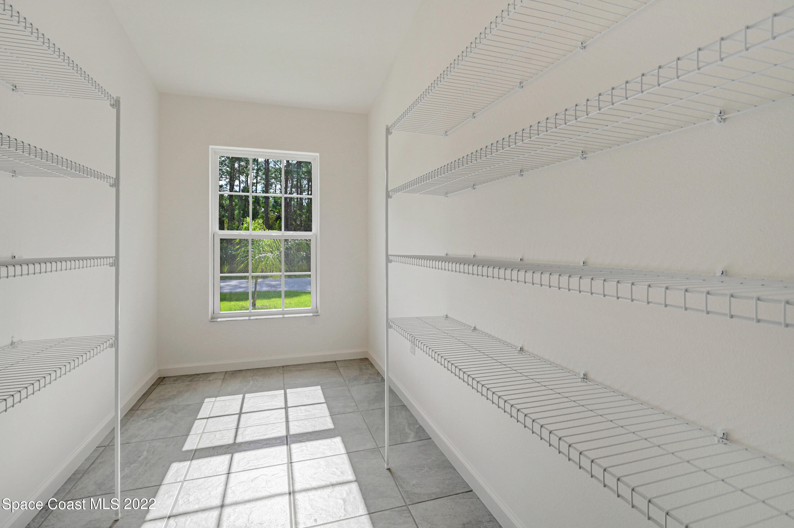 561 Scenic Road Palm Bay, FL 32908 - Photo 28 of 40 a view of empty room with windows