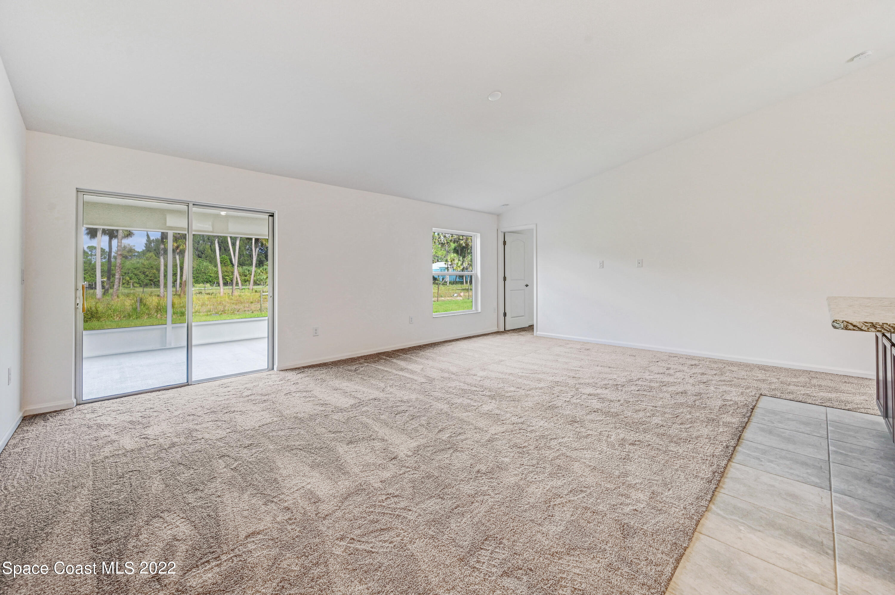 561 Scenic Road Palm Bay, FL 32908 - Photo 30 of 40 a view of an empty room with a window