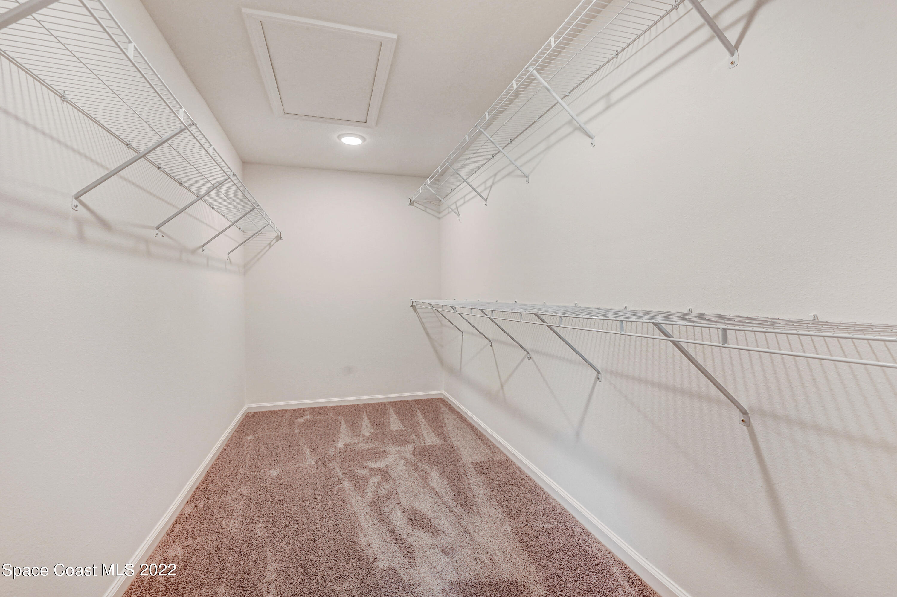 561 Scenic Road Palm Bay, FL 32908 - Photo 34 of 40 a view of a room with racks on the wall