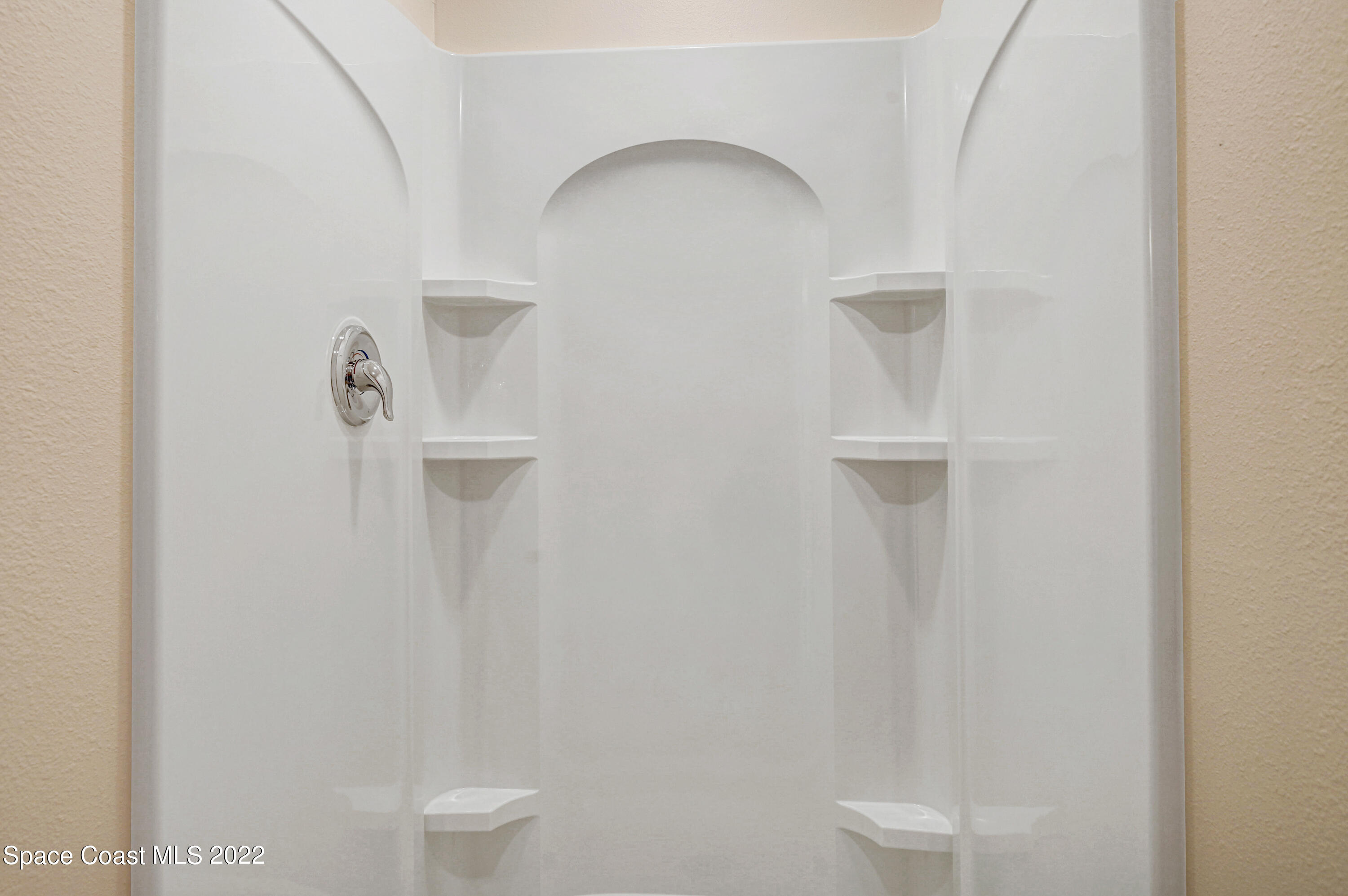 561 Scenic Road Palm Bay, FL 32908 - Photo 36 of 40 a bathroom with a shower