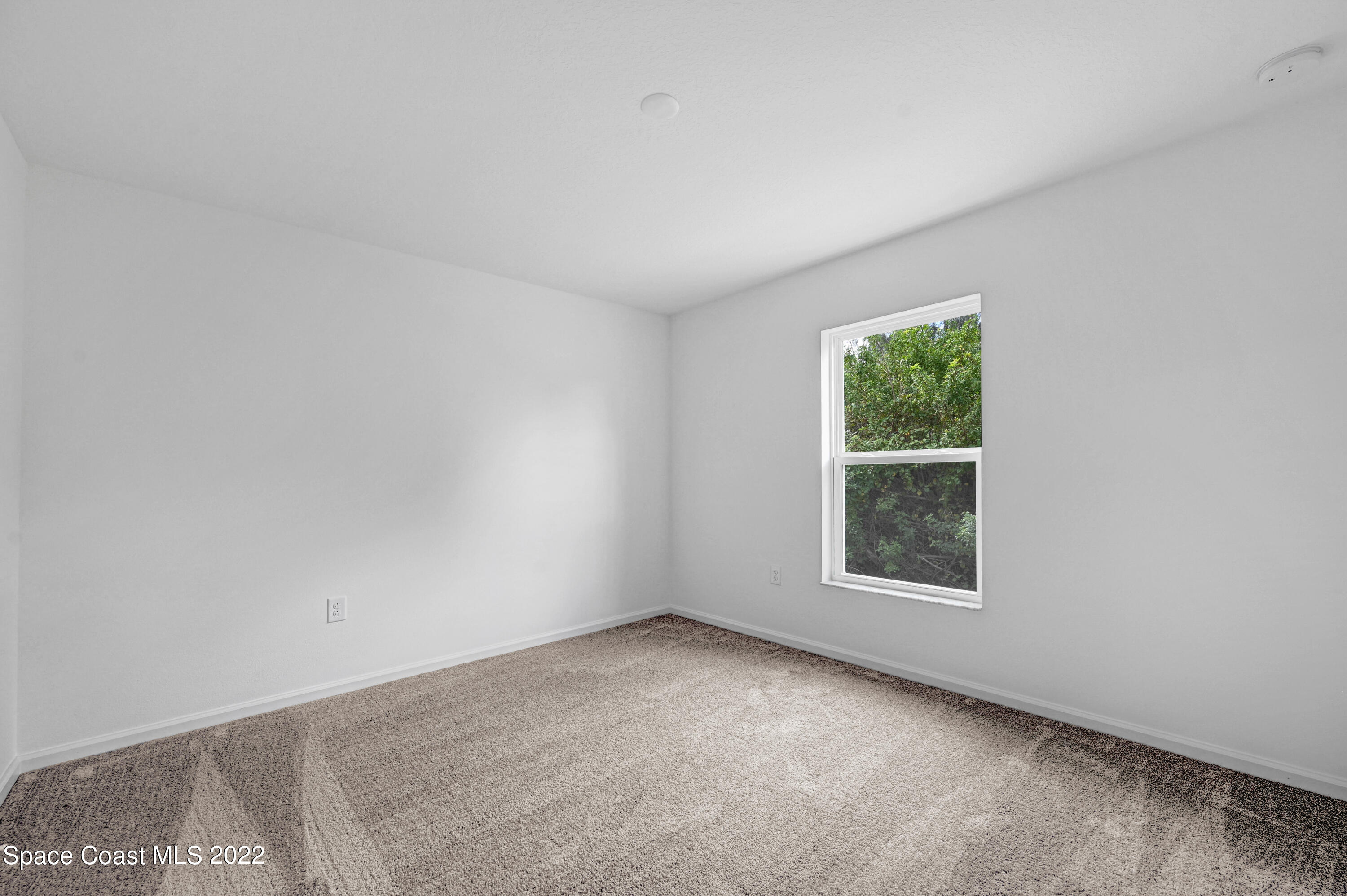561 Scenic Road Palm Bay, FL 32908 - Photo 38 of 40 an empty room with a window