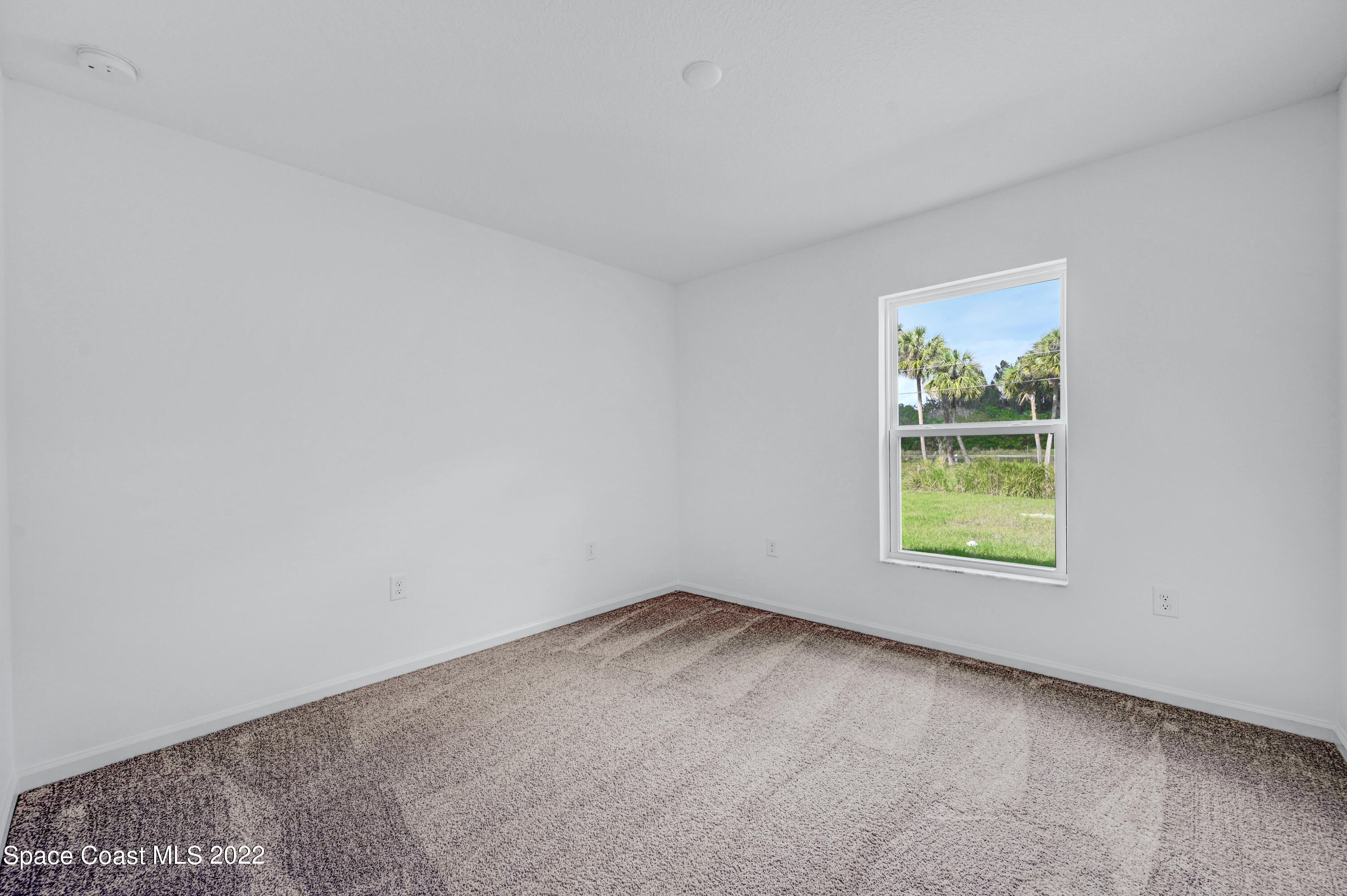 561 Scenic Road Palm Bay, FL 32908 - Photo 39 of 40 an empty room with a window