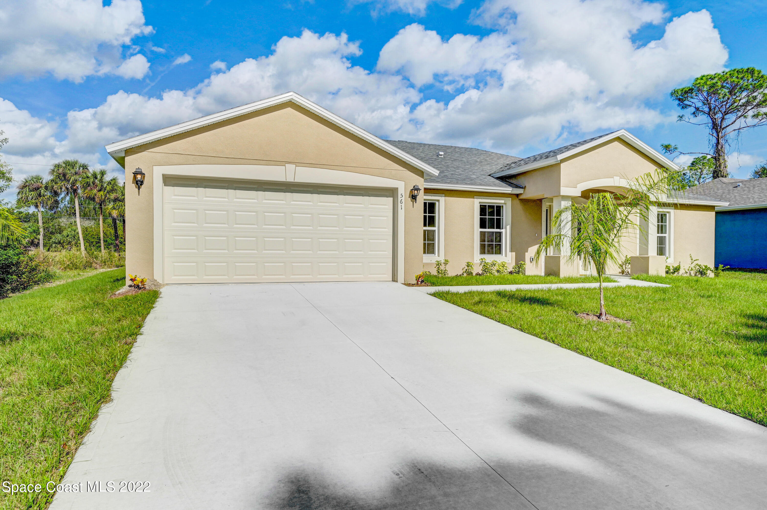 561 Scenic Road Palm Bay, FL 32908 - Photo 5 of 40 a front view of house with yard and green space