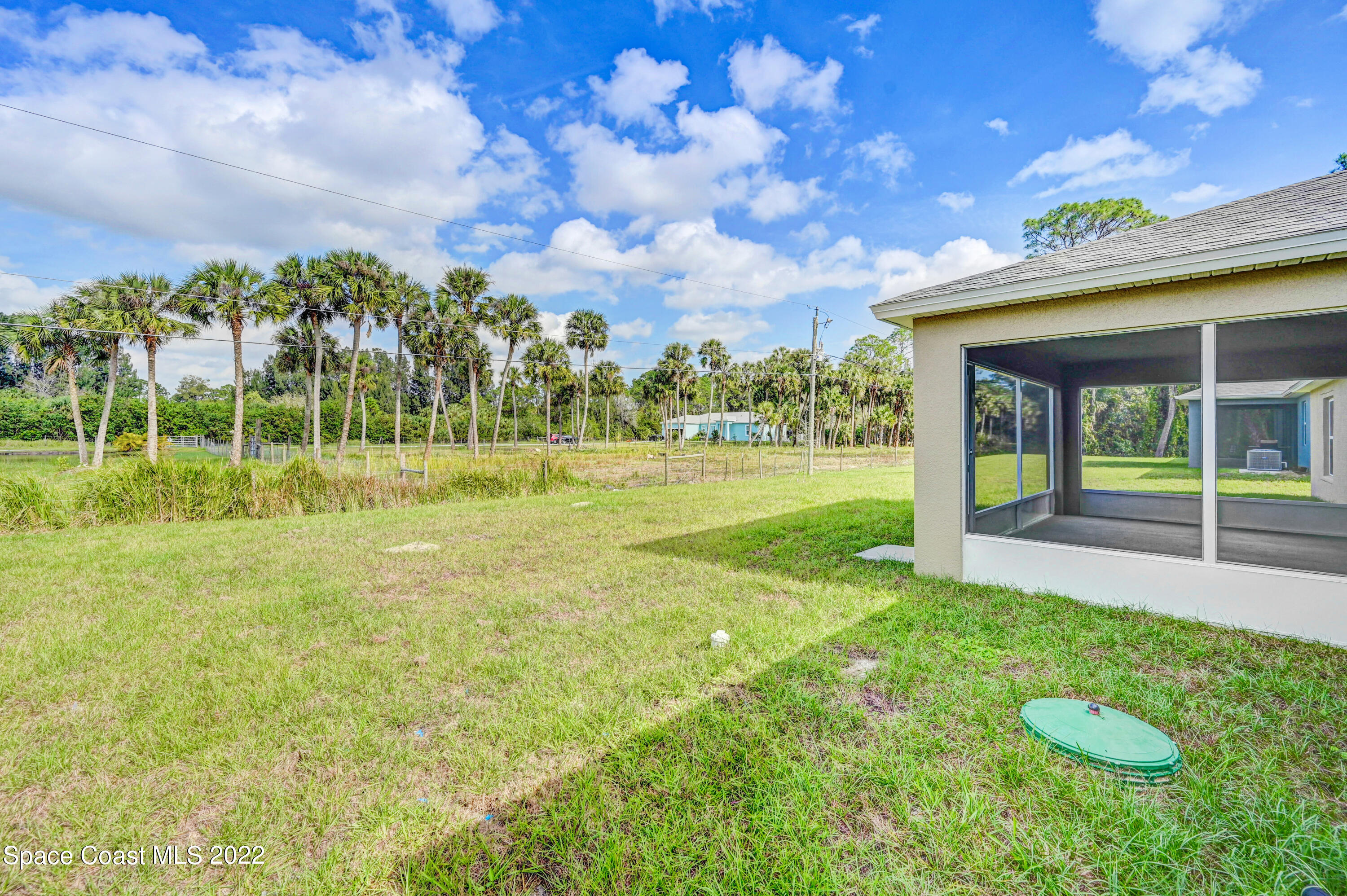 561 Scenic Road Palm Bay, FL 32908 - Photo 8 of 40 a view of a playground with basketball court