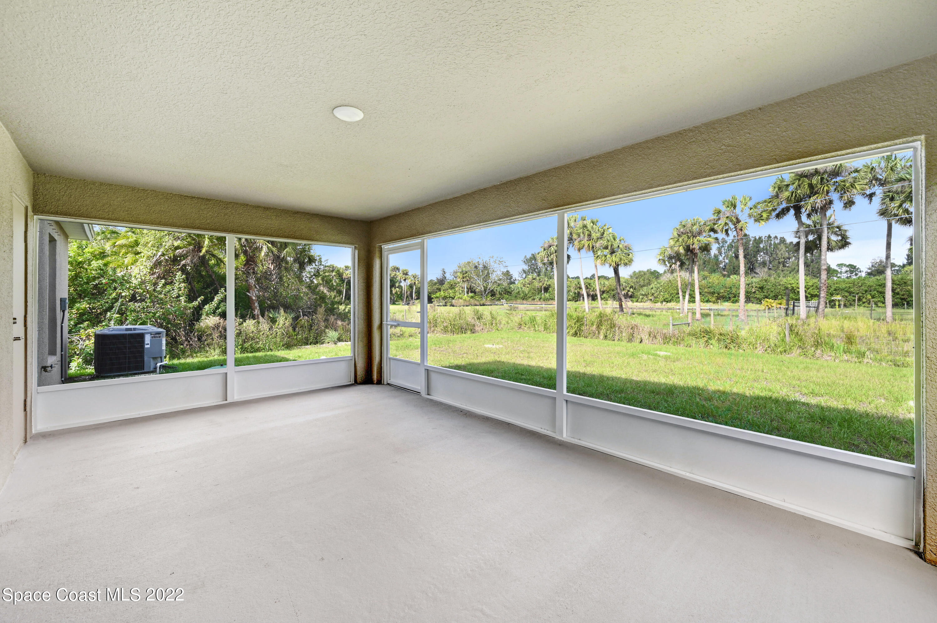 561 Scenic Road Palm Bay, FL 32908 - Photo 10 of 40 a view of a garden with an outdoor seating