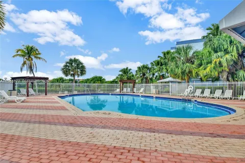 a view of swimming pool with a yard