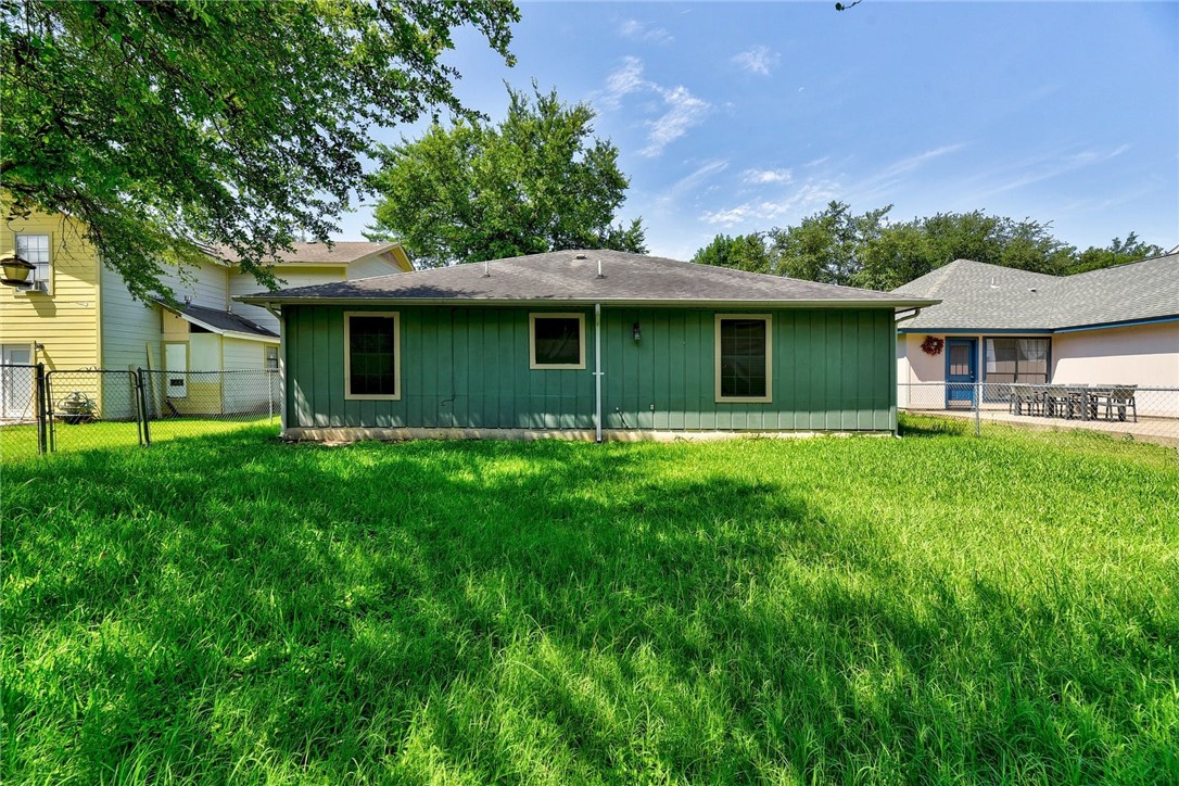 6402 Santos Street Austin, TX 78741 - Photo 20 of 22 a front view of a house with a garden
