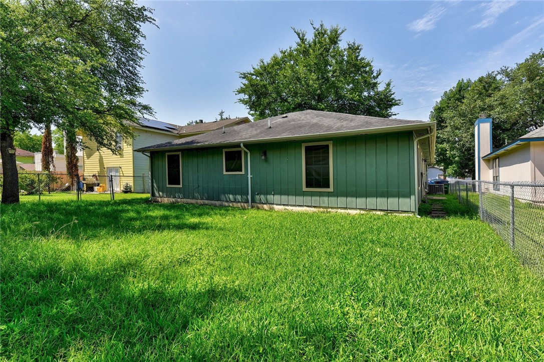6402 Santos Street Austin, TX 78741 - Photo 22 of 22 a view of a house with yard and tree s