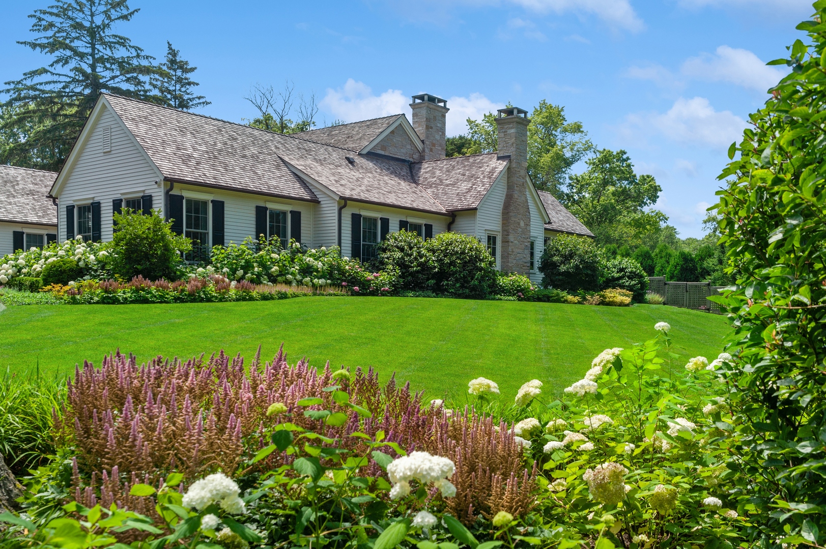 1120 Elm Tree Road Lake Forest, IL 60045 - Photo 3 of 10 a front view of a house with garden