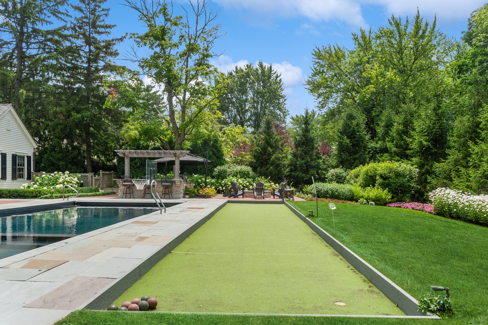 1120 Elm Tree Road Lake Forest, IL 60045 - Photo 7 of 10 a view of a swimming pool with a patio
