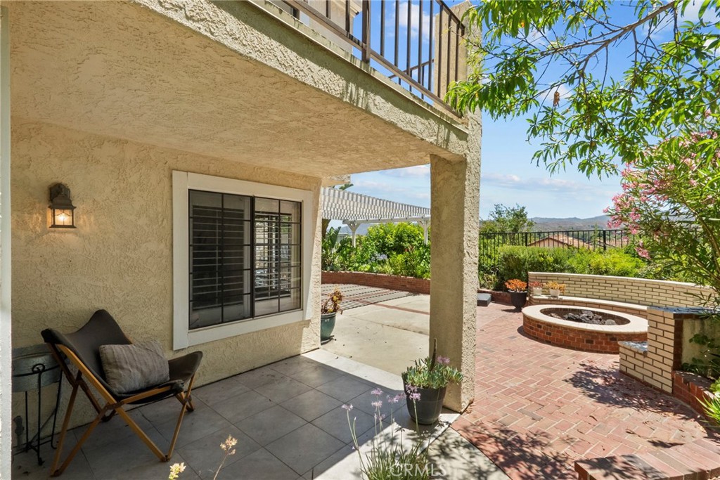 808 Links View Drive Simi Valley, CA 93065 - Photo 27 of 28 a view of house with backyard and outdoor seating