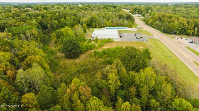 a view of a small yard with wooden fence