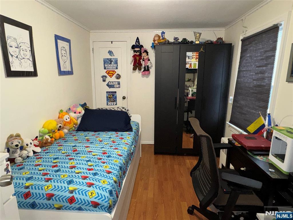 542 Prospect Place Lyndhurst, NJ 07071 - Photo 6 of 7 a bedroom with furniture and a bed