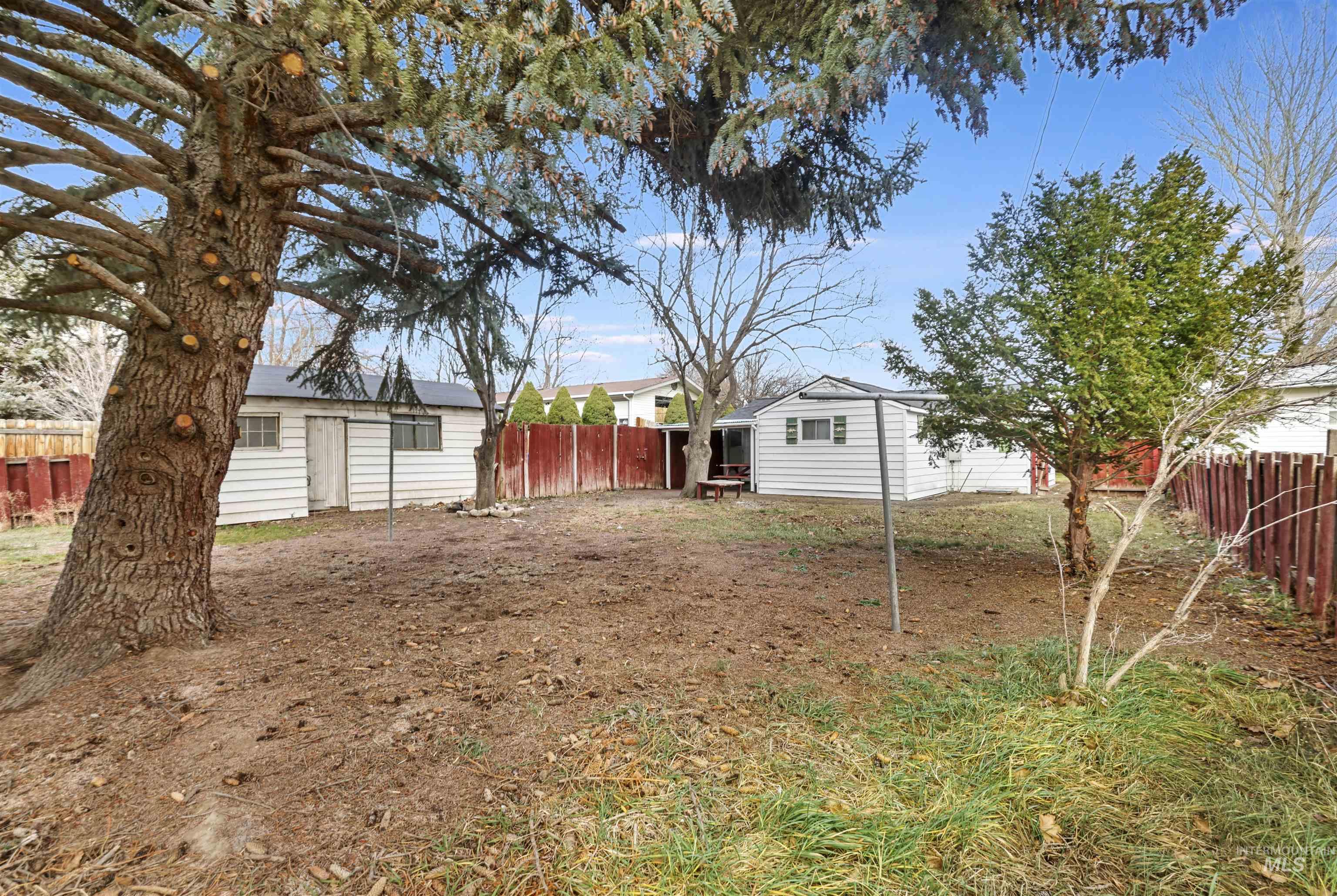 545 Madison Street Twin Falls, ID 83301 - Photo 22 of 23 Fenced backyard with an outdoor structure