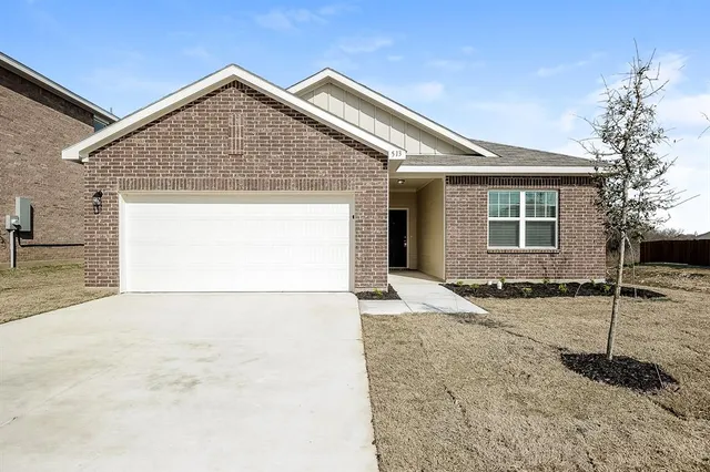 a backyard of a house with wooden fence