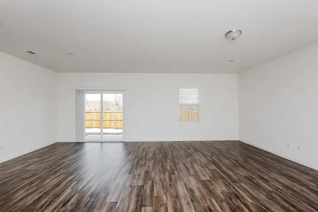 a view of an empty room and window