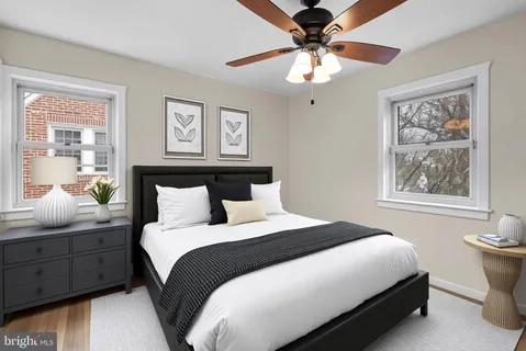 a bedroom with bed and window