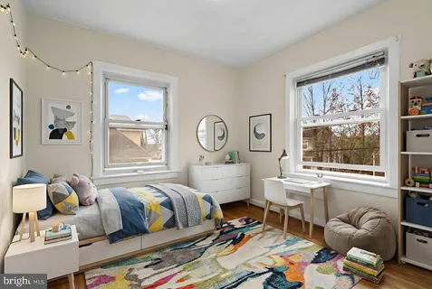 a bed room with furniture and a window