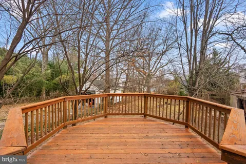 a view of a deck with trees