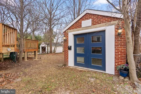 a view of a house with a yard and balcony