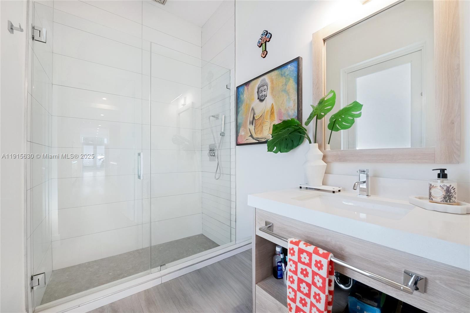 2410 Southwest 16th Avenue Miami, FL 33145 - Photo 16 of 25 a bathroom with a sink a vanity and a mirror