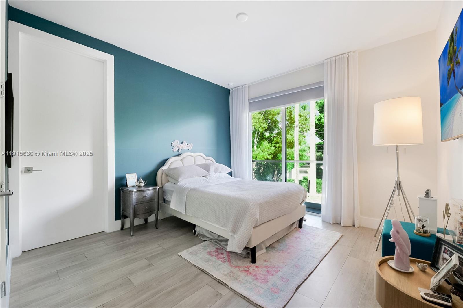 2410 Southwest 16th Avenue Miami, FL 33145 - Photo 20 of 25 a bedroom with a bed and a window