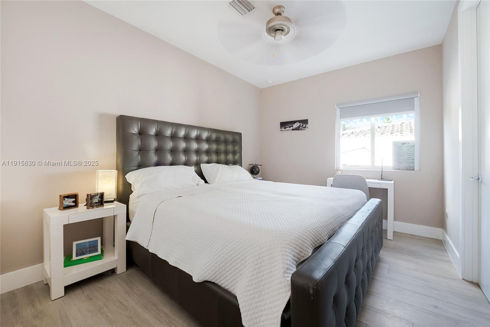 2410 Southwest 16th Avenue Miami, FL 33145 - Photo 22 of 25 a bedroom with a bed and a window