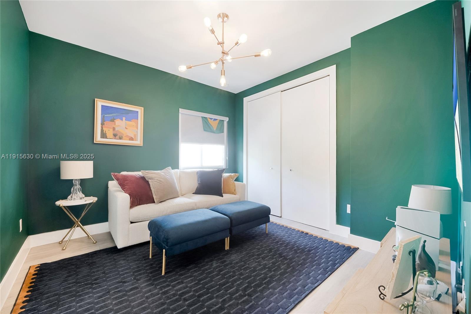 2410 Southwest 16th Avenue Miami, FL 33145 - Photo 23 of 25 a living room with furniture and a wooden floor