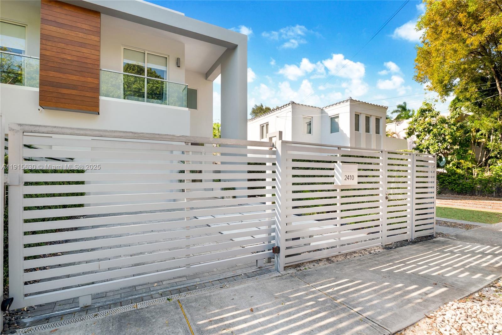 2410 Southwest 16th Avenue Miami, FL 33145 - Photo 25 of 25 a front view of a house with a yard
