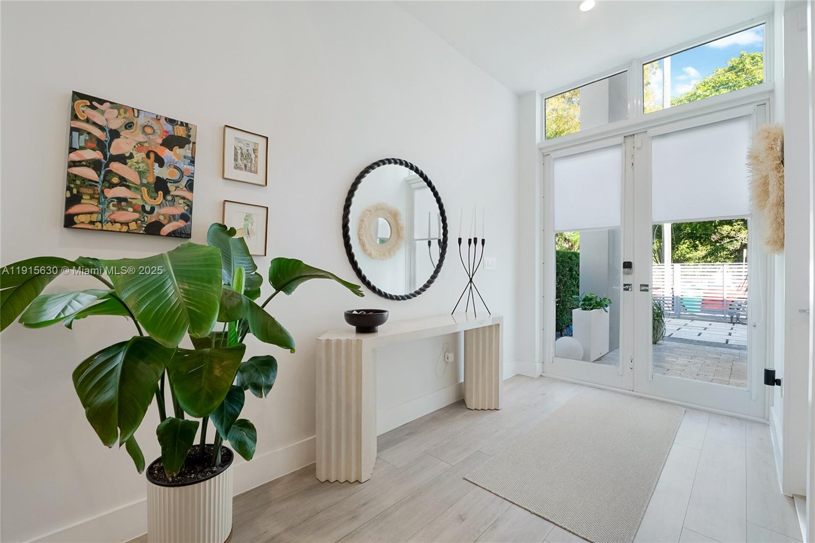 2410 Southwest 16th Avenue Miami, FL 33145 - Photo 4 of 25 a picture of a flower pot with a potted plant on a table