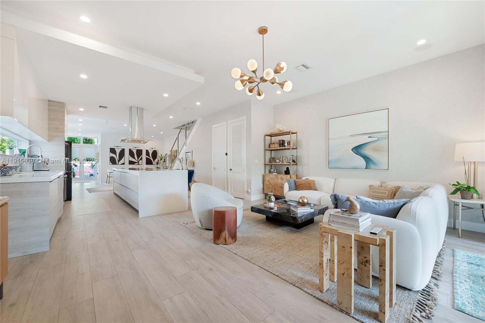 2410 Southwest 16th Avenue Miami, FL 33145 - Photo 6 of 25 a living room with furniture or chandelier and a wooden floor