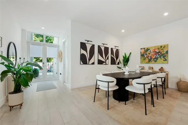 a view of a livingroom with furniture and a potted plant